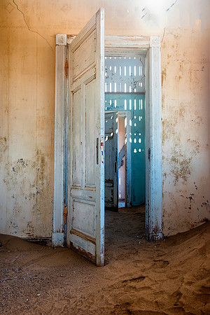 Kolmanskop, "ghost town", Namibia, Africa, desert, Luderitz, sand, diamonds, mine, ruins, door, colors, details, wood, concrete, painting, hospital, house, building, door, window, stairs, cable, wire,